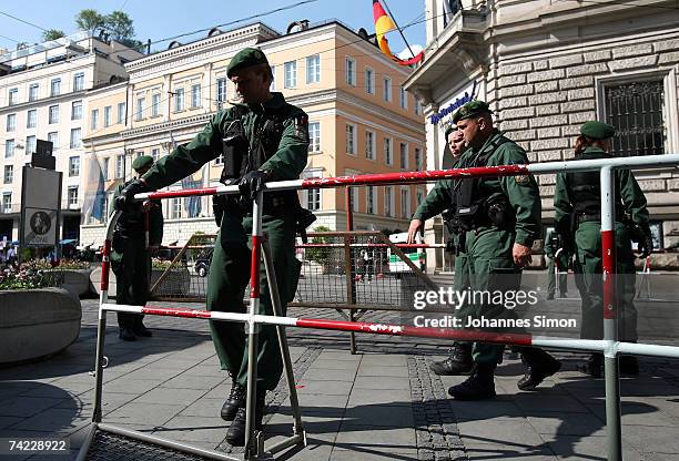 Policemen erect road blocks at Promenadeplatz Square on May 23 in Munich, Germany. The G8 justice and interior ministers meeting will take place at...