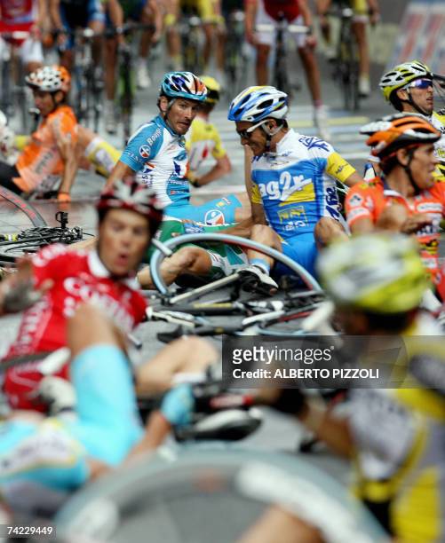 Riders lies after crashing during the final sprint of eleventh stage of the Giro d'Italia cycling race, 198 km leg from Serravalle Scrivia to...