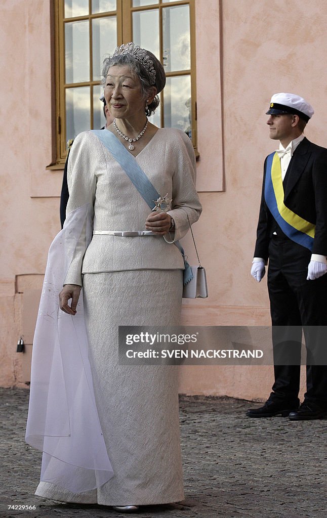 Japanese Empress Michiko walks to attend...