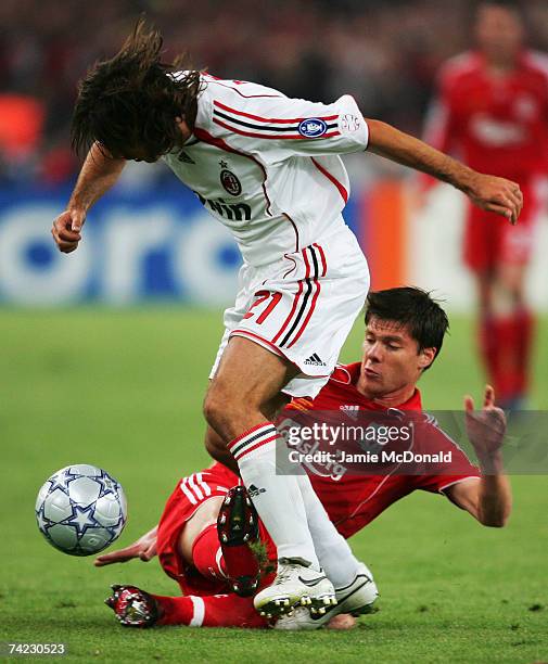 Andrea Pirlo of Milan is tackled by Xabi Alonso of Liverpool during the UEFA Champions League Final match between Liverpool and AC Milan at the...