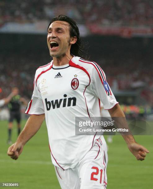 Andrea Pirlo of Milan celebrates after taking the free kick, that lead to teammate Filippo Inzaghi scoring the opening goal during the UEFA Champions...