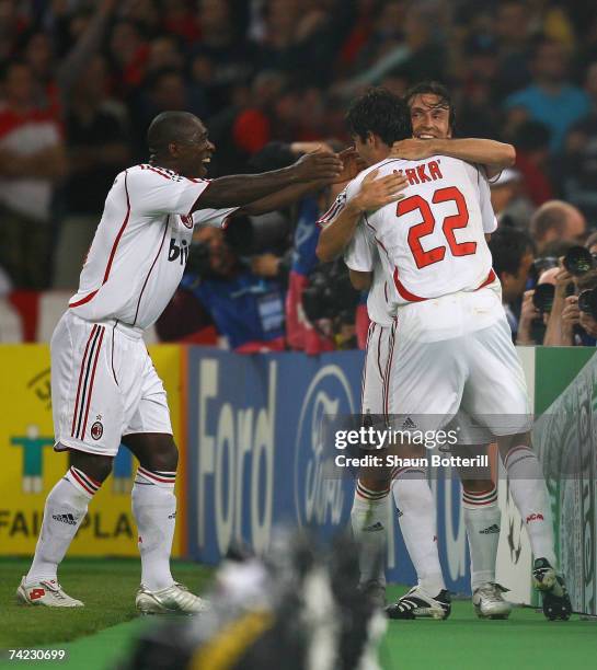 Andrea Pirlo of Milan celebrates with teammates, Kaka and Clarence Seedorf after taking the free kick, that lead to teammate Filippo Inzaghi scoring...