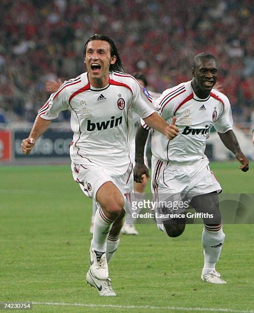 Andrea Pirlo of Milan celebrates with teammate, Clarence Seedorf after taking the free kick, that lead to teammate Filippo Inzaghi scoring the...