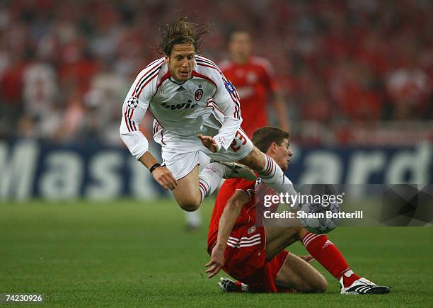 Massimo Ambrosini of Milan is tackled by Steven Gerrard of Liverpool during the UEFA Champions League Final match between Liverpool and AC Milan at...