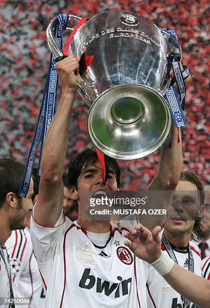 Milan's Brazilian midfielder Kaka holds the trophy after winning the Champions League final football match against Liverpool, at the Olympic Stadium,...