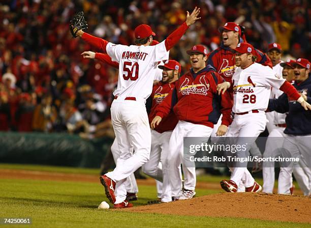 Pitcher Adam Wainwright of the St. Louis Cardinals celebrates with his teammates after defeating the Detroit Tigers in Game Five of the 2006 World...