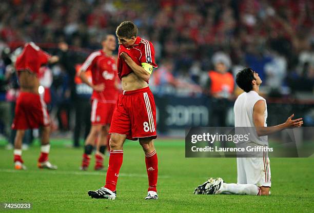 Dejected Steven Gerrard of Liverpool looks on, whilst Kaka of Milan celebrrates his teams 2-1 victory during the UEFA Champions League Final match...