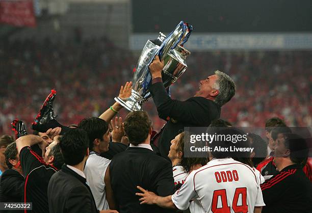 Carlo Ancelotti, the manager of AC Milan jolds the trophy aloft in celebration following his teams 2-1 victory during the UEFA Champions League Final...