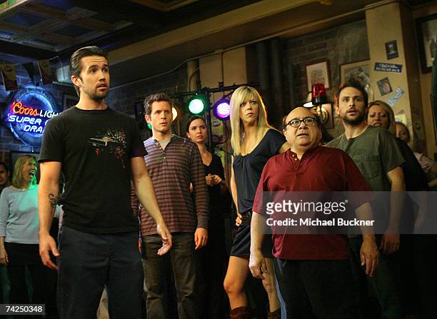 Actors Rob McElhenney, Glenn Howerton, Kaitlin Olson, Danny DeVito and Charlie Day act during a dance scene on the set of "It's Always Sunny In...
