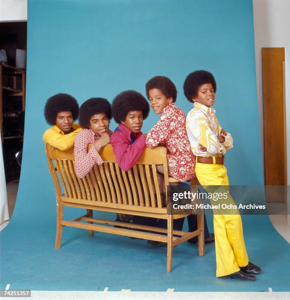 Quintet "Jackson Five" pose for a studio portrait sitting on a bench in circa 1972 in Los Angeles, California. L-R: Tito Jackson, Jackie Jackson,...