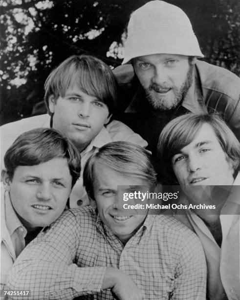 Rock and roll band "The Beach Boys" pose for a portrait in 1966. Clockwise from left: Bruce Johnston, Carl Wilson, Mike Love, Dennis Wilson, Al...