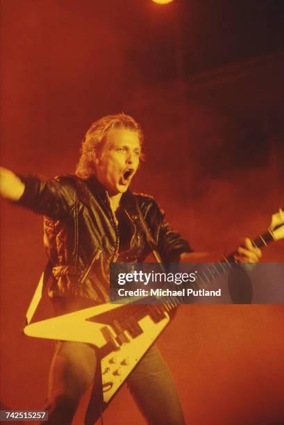 German guitarist Michael Schenker performs live on stage, playing a Gibson Flying V guitar, with the Michael Schenker Group at the Reading Festival,...