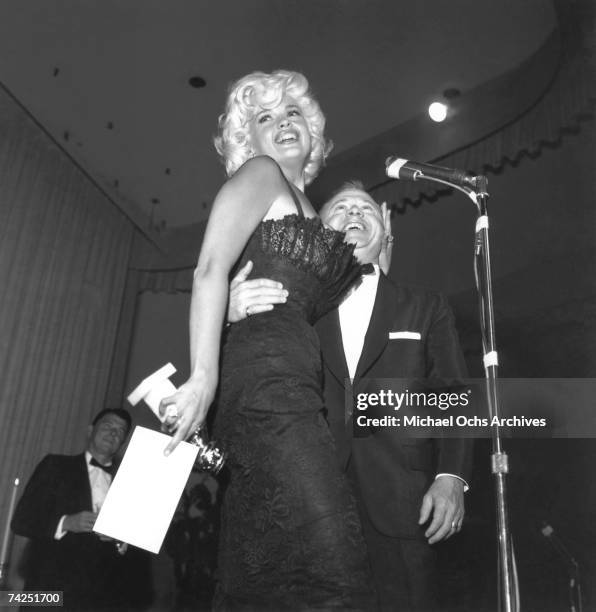 American actress Jayne Mansfield and actor Mickey Rooney smile onstage at the 18 Golden Globe Awards, Los Angeles, California, March 16, 1961....