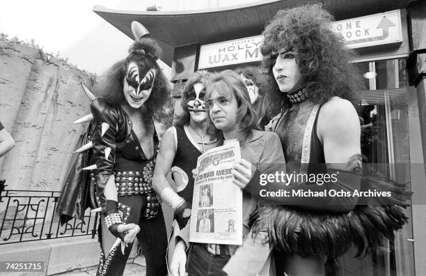 Gene Simmons, Ace Frehley, Paul Stanley and Peter Criss of the rock and roll band "Kiss" joke around with fans and cause mayhem at Grauman's Chinese...