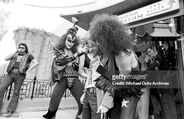 Gene Simmons, Ace Frehley, Paul Stanley and Peter Criss of the rock and roll band "Kiss" joke around with fans and cause mayhem at Grauman's Chinese...