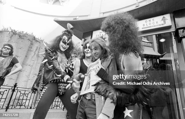 Gene Simmons, Ace Frehley, Paul Stanley and Peter Criss of the rock and roll band "Kiss" joke around with fans and cause mayhem at Grauman's Chinese...