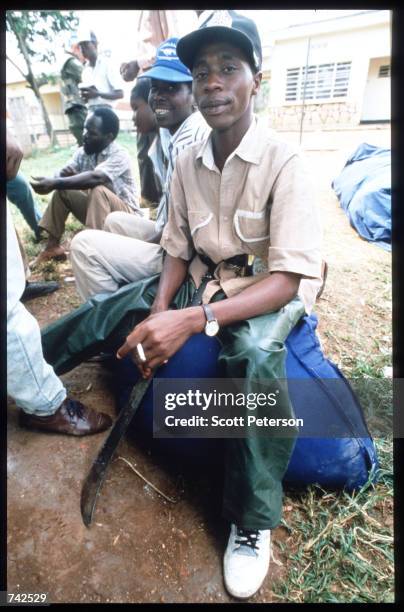 Hutu militia men pose May 25, 1994 in Rwanda. Following the assassination of President Juvenal Habyarimana in April, 1994 genocide of unprecedented...