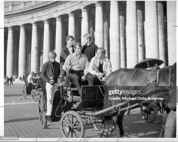 Rock and roll group "The Beach Boys" pose for a portrait riding in the back of a horse drawn carriage in November 12,1964 in Italy. Dennis Wilson,...