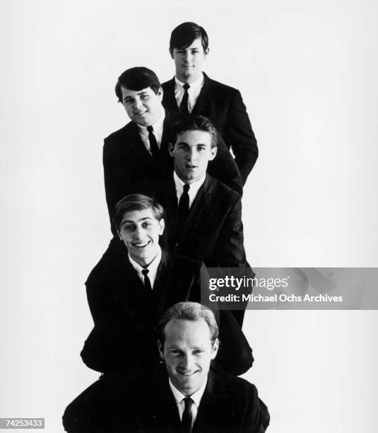 Rock and roll band "The Beach Boys" pose for a portrait in 1963. Top to bottom: Brian Wilson, Carl Wilson, Dennis Wilson, David Marks, Mike Love.