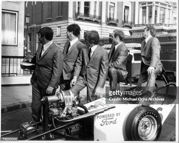 Rock and roll band "The Beach Boys" poses for a portrait with a hot rod car on November 2, 1964 in London, England. Carl Wilson, Brian Wilson, Dennis...