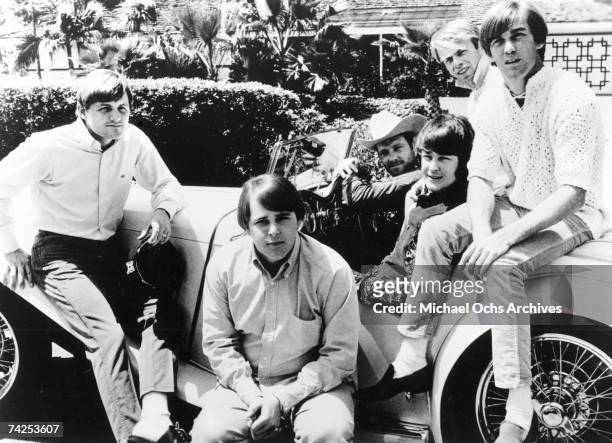 Rock and roll band "The Beach Boys" pose for a portrait with an antique car in 1966. Bruce Johnston, Carl Wilson, Mike Love, Brian Wilson, Al...