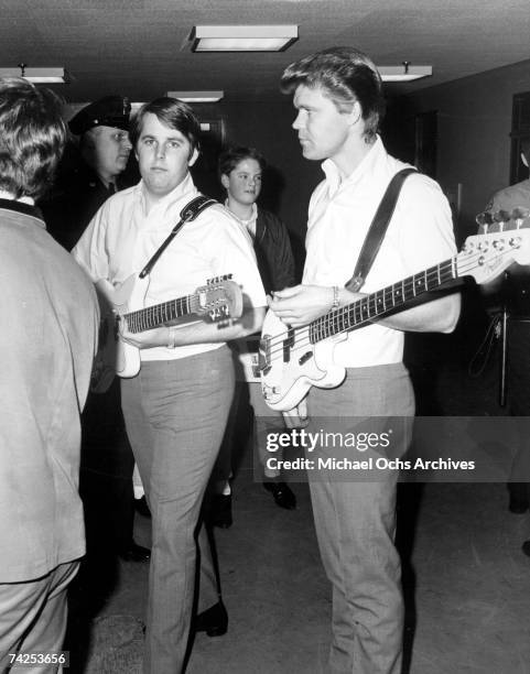 Singer Glen Campbell and guitarist Carl Wilson of the rock and roll band "The Beach Boys" waiting backstage for a performance in 1965. Campbell...