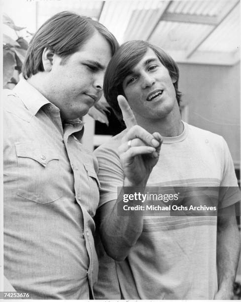 Guitarist Carl Wilson and drummer Dennis Wilson of the rock and roll band "The Beach Boys" pose for a portrait in circa 1966.