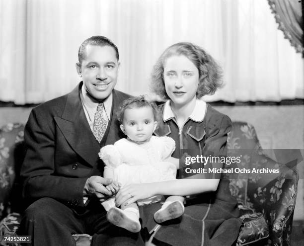 Big Band leader Cab Calloway poses with his wife Wenonah "Betty" Calloway and daughter Constance Calloway pose for a portrait in 1939 in New York...