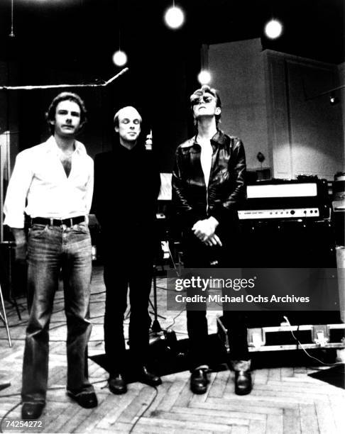 Robert Fripp, Brian Eno and David Bowie pose for a portrait in the studio where they are recorded "Heroes" in 1977 in Berlin, Germany. Photo by...