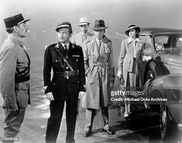 Movie still of Unidentified, Claude Rains, Paul Henreid, Humphrey Bogart and Ingrid Bergman on the set of the Warner Bros classic film 'Casablanca'...