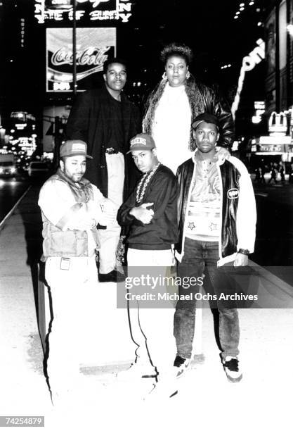 One, Ms Melodie and D-Nice pose with other members of Boogie Down Productions in Times Square in circa 1988 in New York, New York.