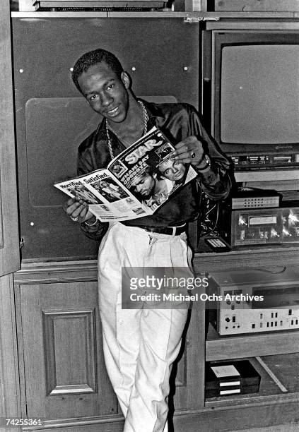 Singer Bobby Brown poses for a portrait session holding an October 1986 issue of Right On Magazine in Los Angeles, California.