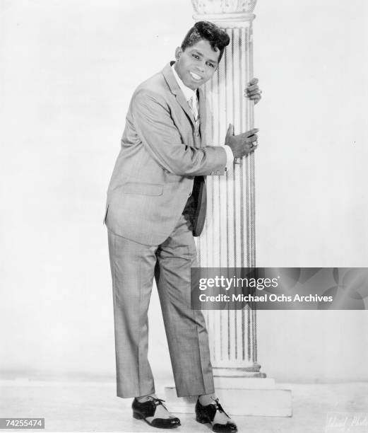 "Godfather of Soul" James Brown poses for a portrait leaning against a column in 1956 in New York, New York.
