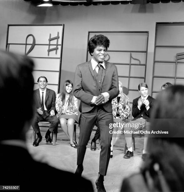 Soul singer James Brown performs at KCOP Studios on the Lloyd Thaxton Show in 1964 in Los Angeles, California.