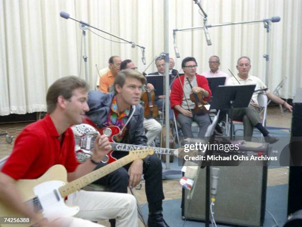 Singer and Songwriter Glen Campbell and guitarist James Burton record at the Columbia Records Studio on September 15, 1967 in Los Angeles, California.