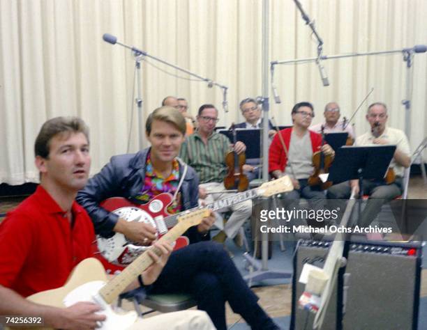 Singer and Songwriter Glen Campbell and guitarist James Burton record at the Columbia Records Studio on September 15, 1967 in Los Angeles, California.