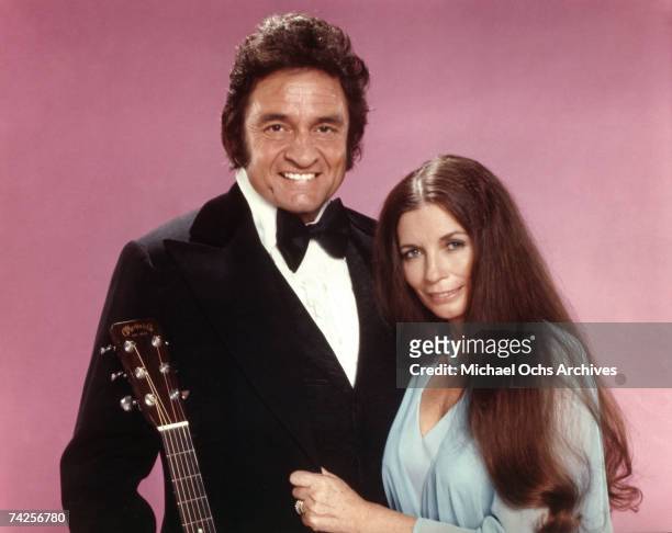 Married country singers Johnny Cash & June Carter Cash pose for a portrait in circa 1975.