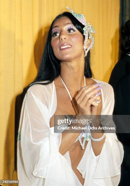 Entertainer Cher attends the Grammy awards wearing a large butterfly pin in her hair on March 2, 1974 in Los Angeles, California.