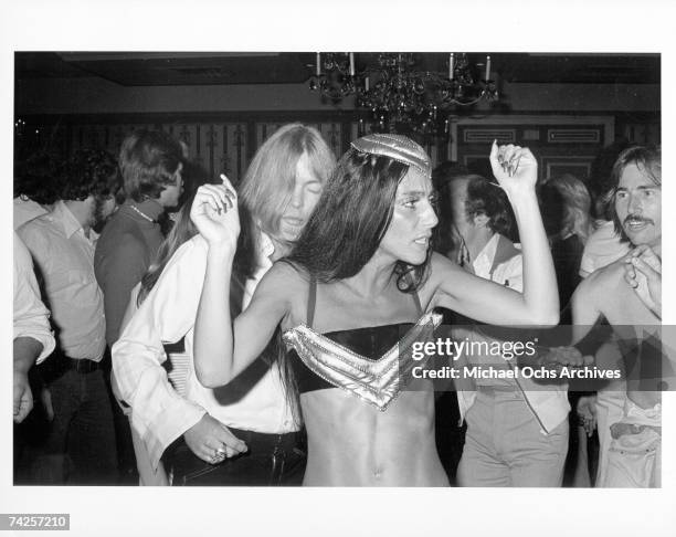 Entertainers and celebrity couple Gregg Allman and Cher attend a party in honor of the Doobie Brothers on May 2, 1975 in Los Angeles, California.