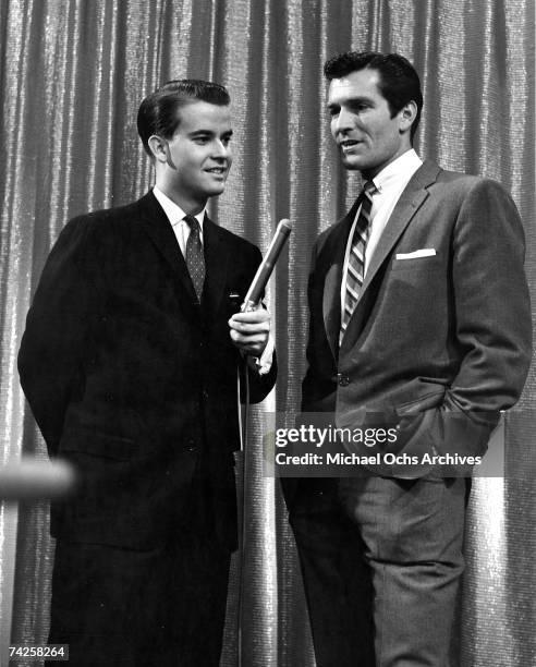 Host of television show "American Bandstand" Dick Clark interviews star of the television series "The Life And Legend Of Wyatt Earp" Hugh O'Brian on...