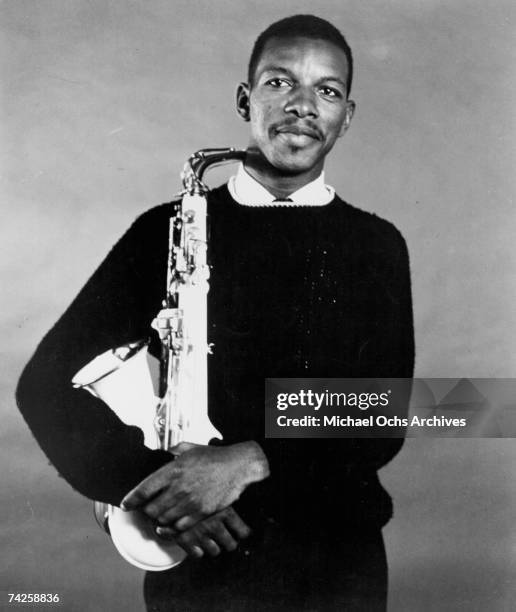 Jazz saxophonist Ornette Coleman poses for a portrait holding his saxophone in circa 1959.