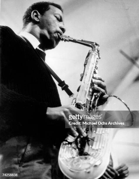 Jazz saxophonist Ornette Coleman performs onstage with his saxophone in circa 1960.