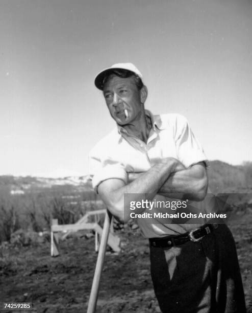 Actor Gary Cooper poses for a portrait session on a ski trip in circa 1952 in Aspen, Colorado.