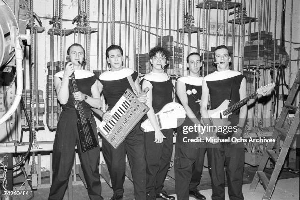 Gerald Casale, Bob Casale, Mark Mothersbaugh, Alan Myers and Bob Mothersbaugh of the new wave punk music group "Devo" pose for a portrait on...