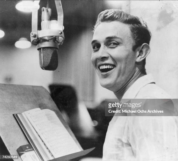 Entertainer and businessman Jimmy Dean recording in the studio in circa 1957.