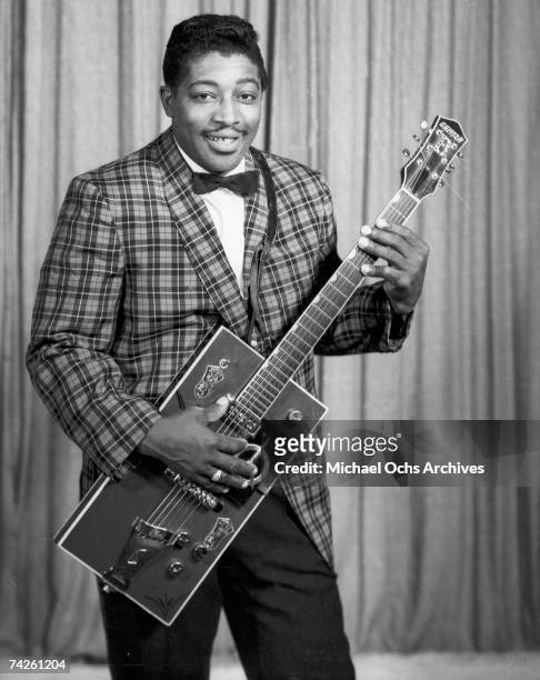 Bo Diddley poses for a portrait with his trademark square Gretsch electric guitar in circa 1957 in New York City, New York.