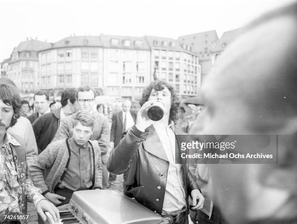 American singer-songwriter Jim Morrison of The Doors, on the Römerberg, during a performance in Frankfurt, West Germany, 14th September 1968. On the...