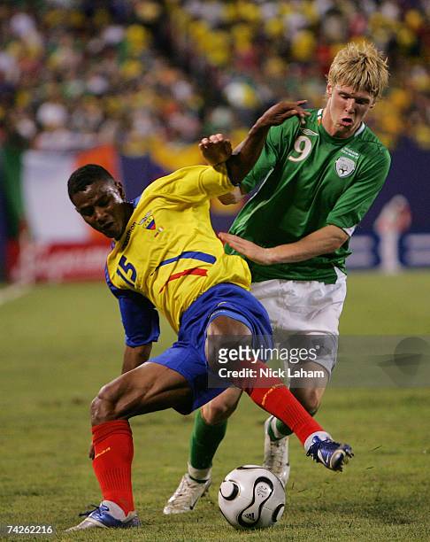 Andrew Keogh of the Republic of Ireland challenges Oscar Bagui of Ecuador during their International Friendly at Giants Stadium in the Meadowlands on...
