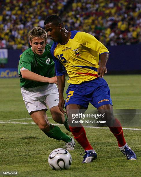 Kevin Doyle of the Republic of Ireland challenges Oscar Bagui of Ecuador during their International Friendly at Giants Stadium in the Meadowlands on...