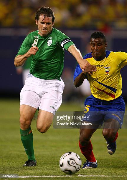 Kevin Kilbane of the Republic of Ireland and Oscar Bagui of Ecuador challenge for possession during their International Friendly at Giants Stadium in...